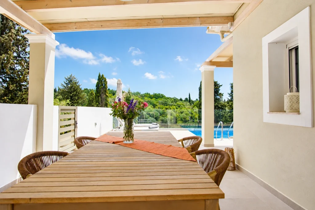 giardinia corfu holiday homes outdoor dining pergola pool view