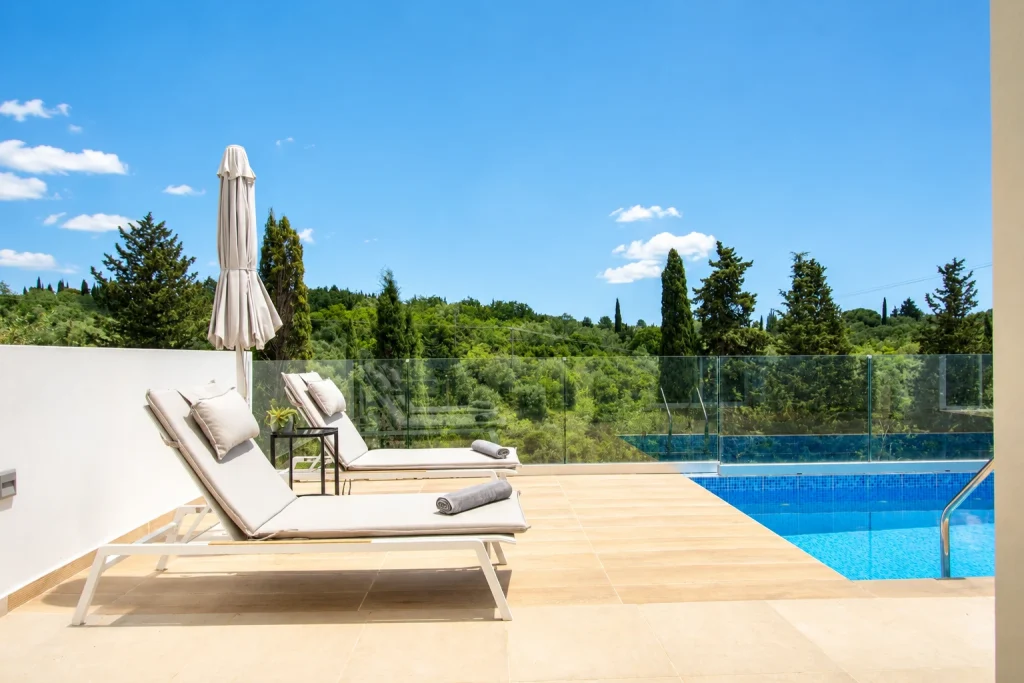 giardinia corfu holiday homes pool terrace loungers hillside view